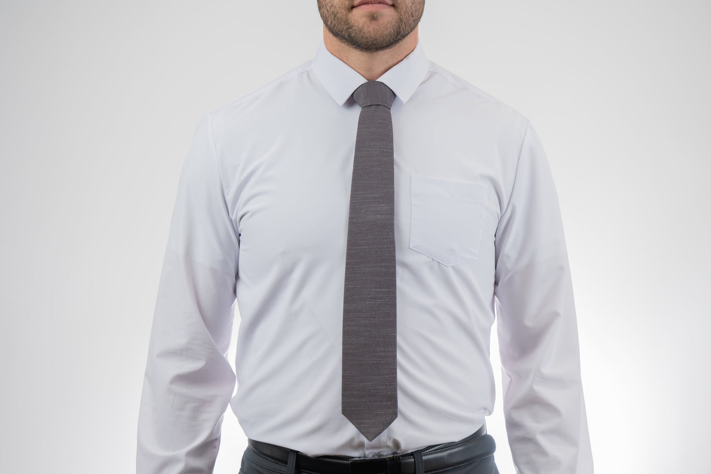 Man wearing a cool, modern, charcoal gray necktie