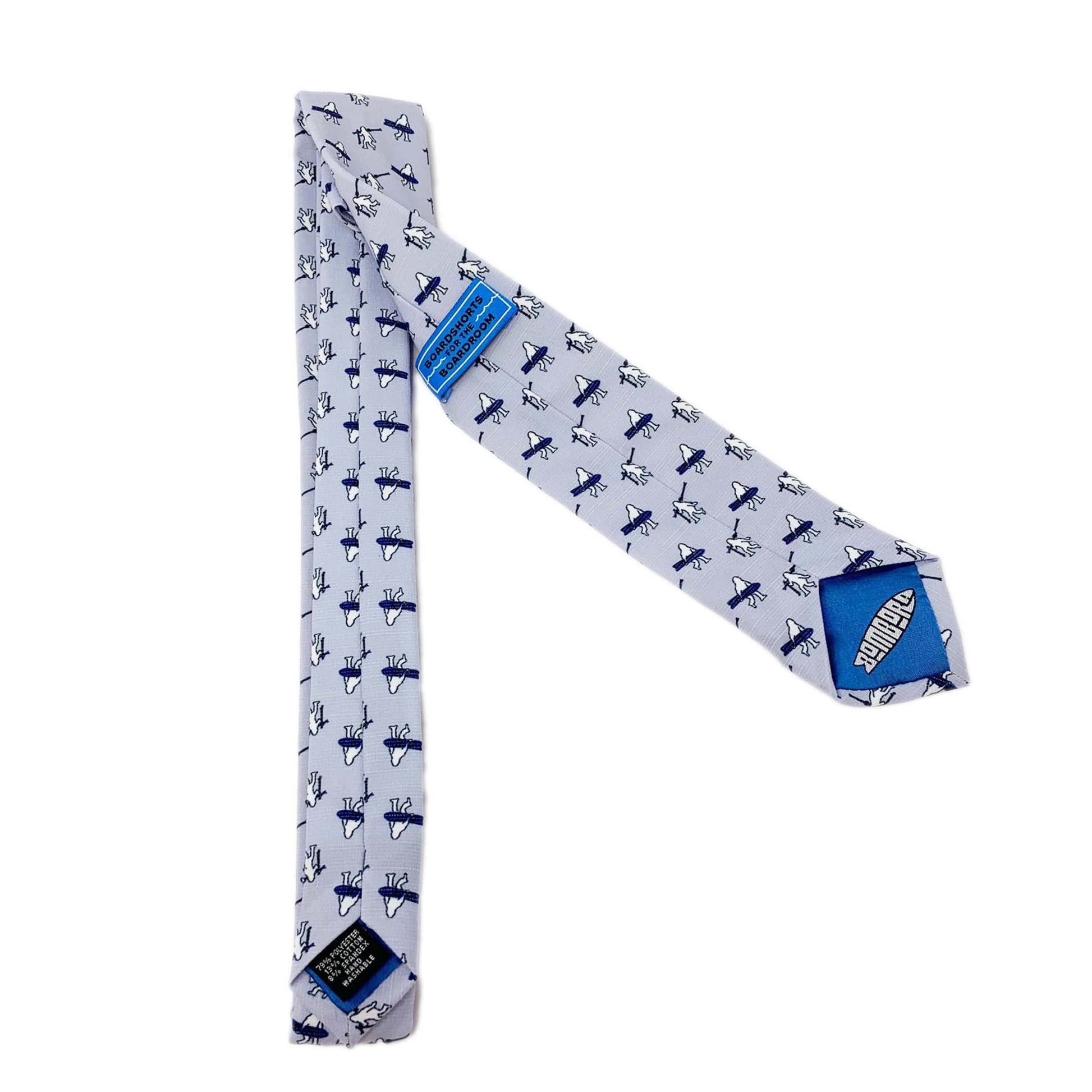 A necktie with yetis carrying skis and snowboards. Everyday tie from Kator Shop — versatile Utah menswear piece blending comfort, simplicity, and class.